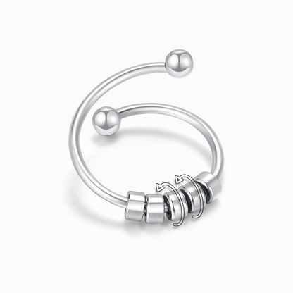 Silver ring with beads on a white background