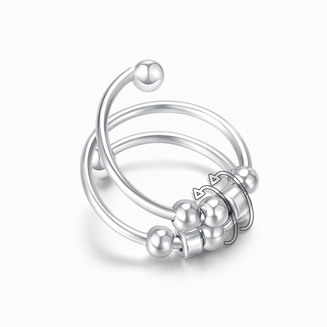 Silver ring with beads on a white background