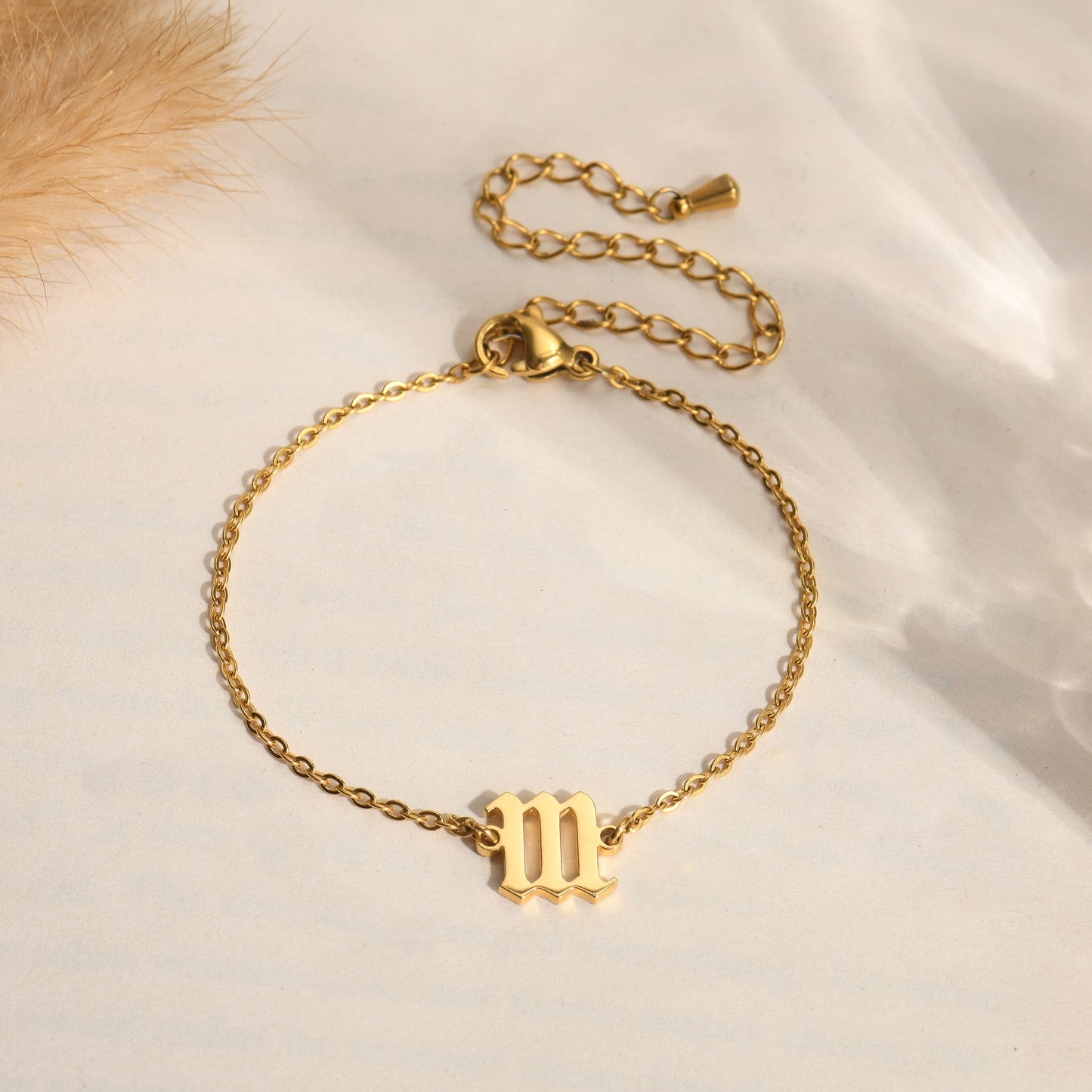 Gold angel number 111 bracelet on  a plain canvas with floral background