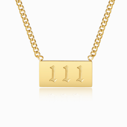 Gold chain necklace with gold angel number 111 oendanton a white background