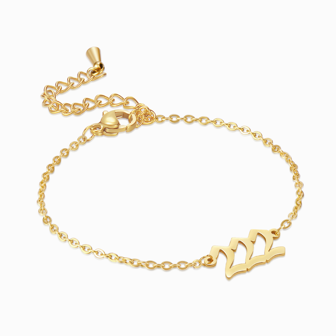 Gold angel number 222 bracelet on a white background