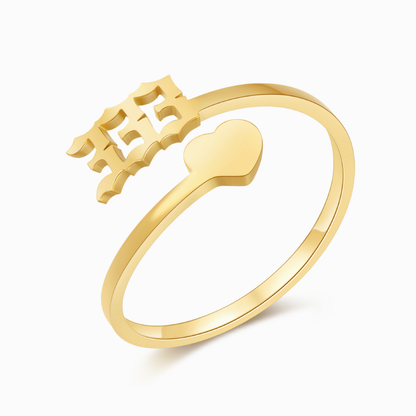 A gold ring with angel number 333 and heart symbol on a white background.