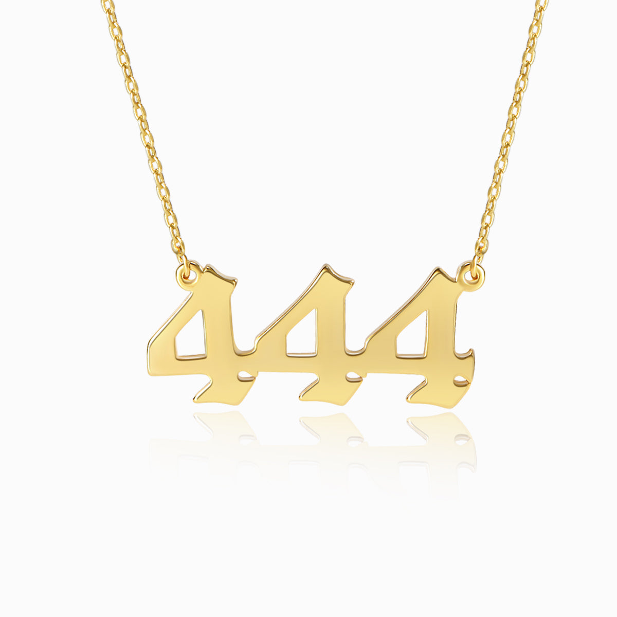 Gold necklace with angel number 444 pendant on a white background