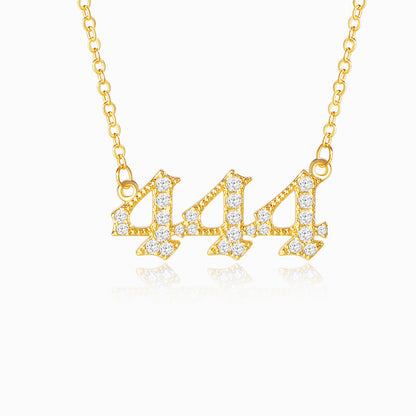 Gold necklace with angel number 444 pendant on a white background