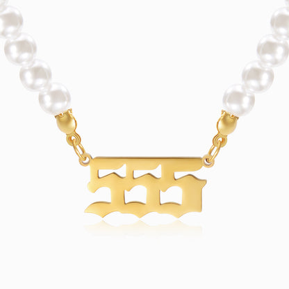 Pearl chain with gold angel number 555 pendant on white background