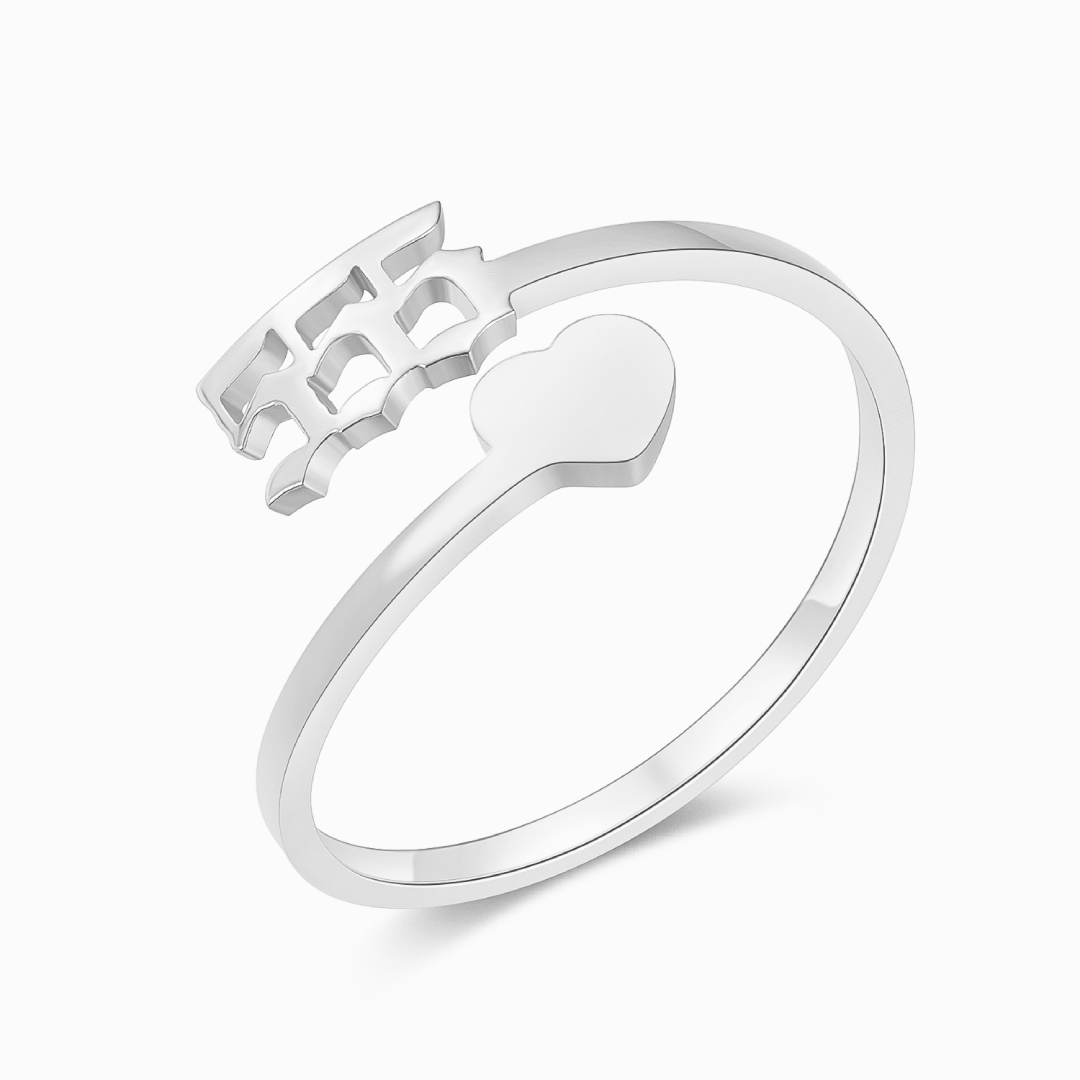 A silver ring with angel number 555 and a heart symbol on a white background