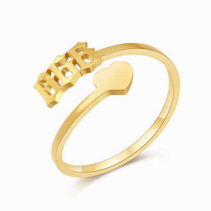 A gold ring with angel number 666 and  heart symbol on a white background