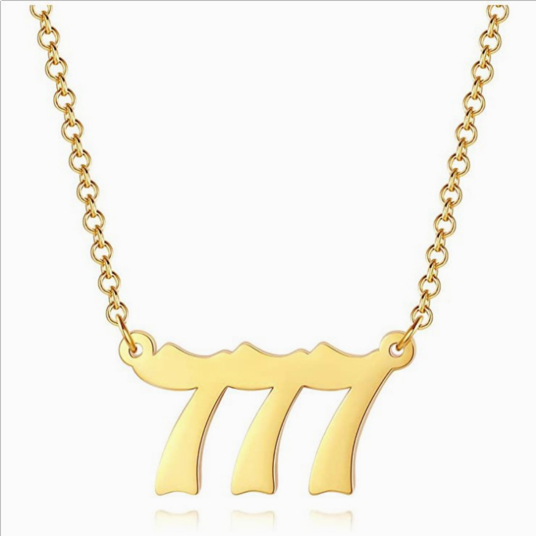 Gold chain necklace with old angel number 777 on white background