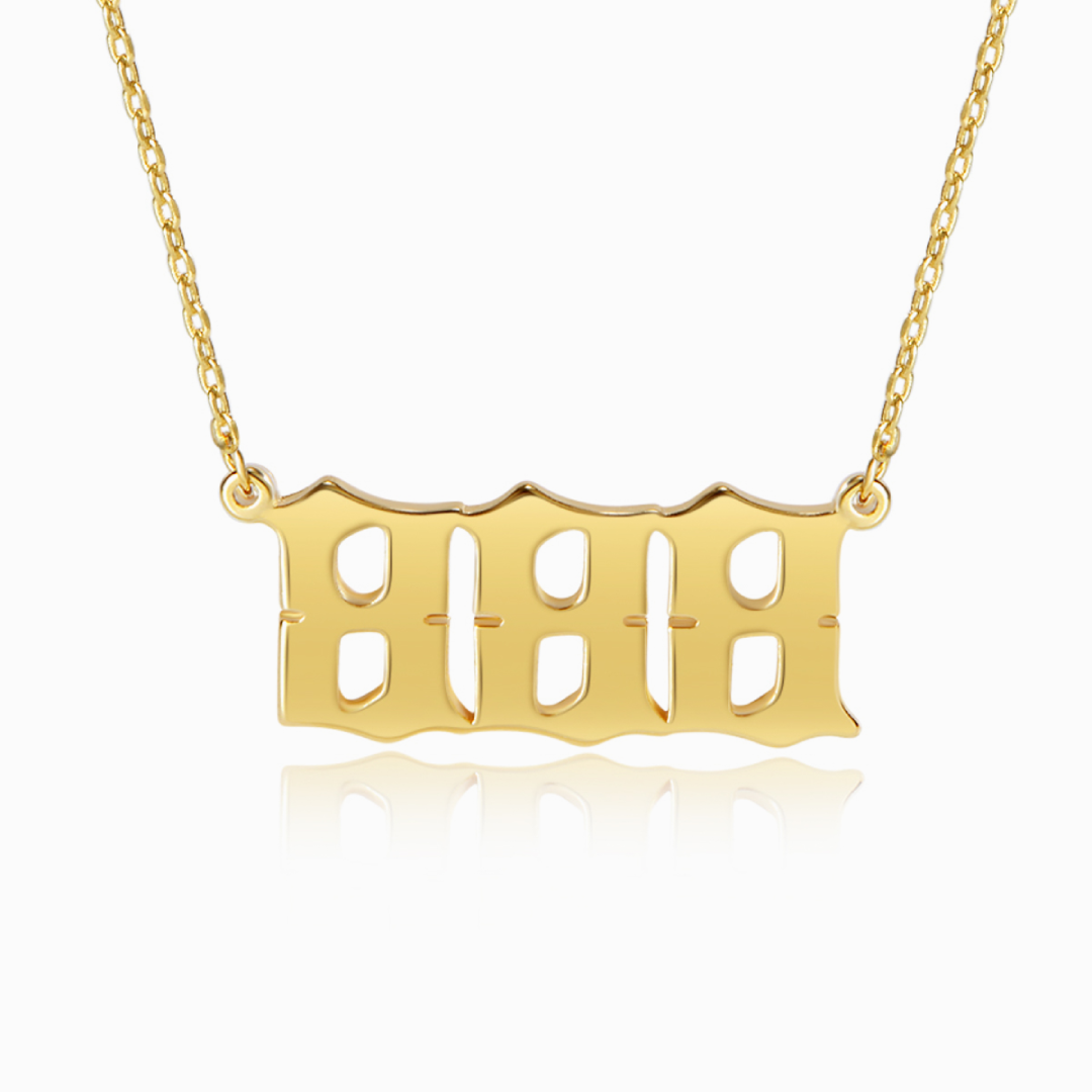 A gold chain necklace with angel number 888 pendant on a white background