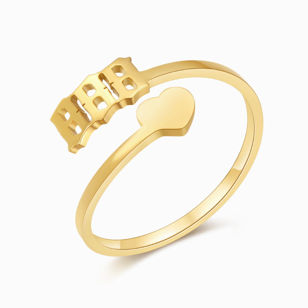 A gold ring with angel number 888 and a heart symbol on a white background