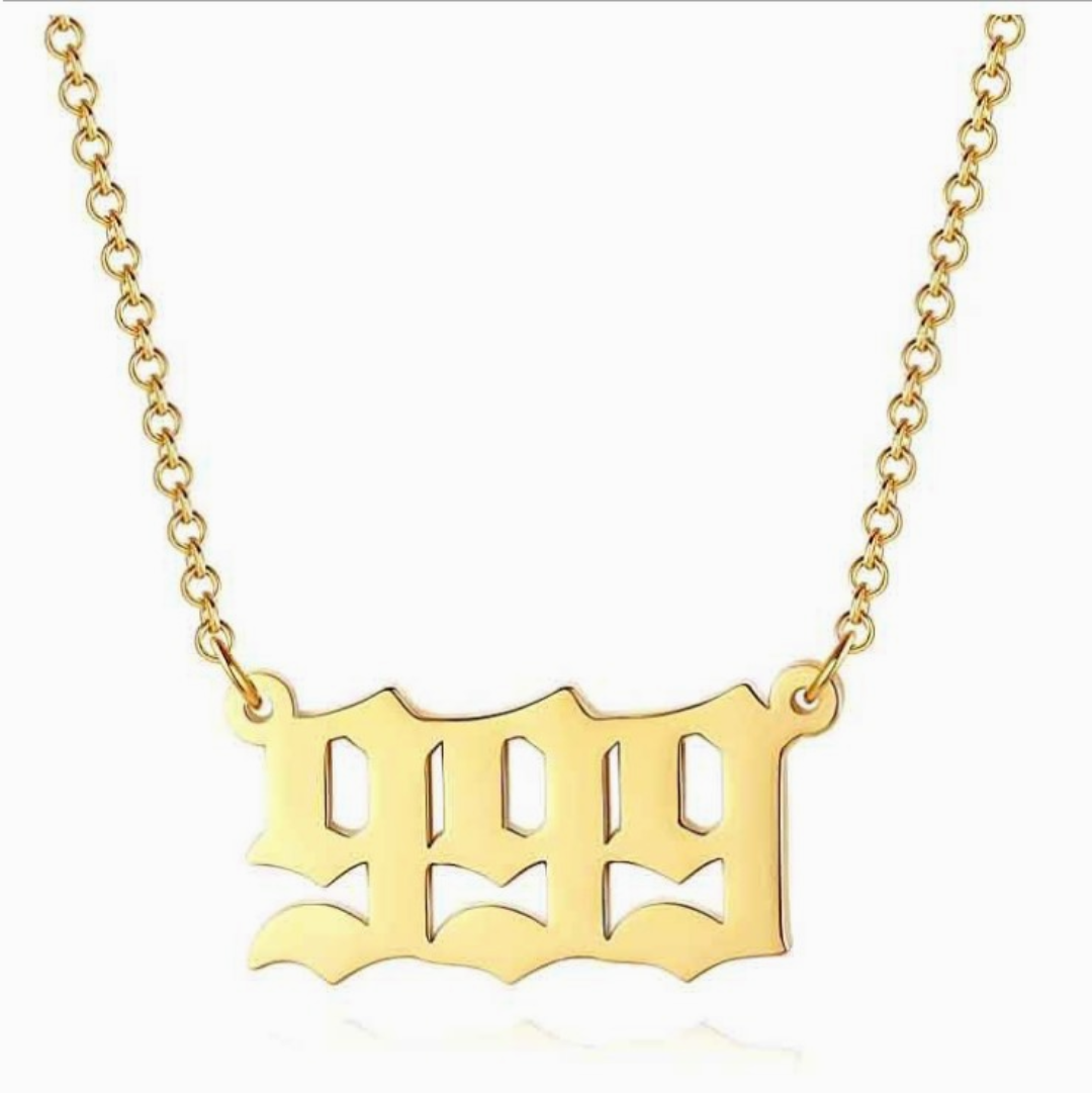 Gold chain necklace with angel number 999 on white background