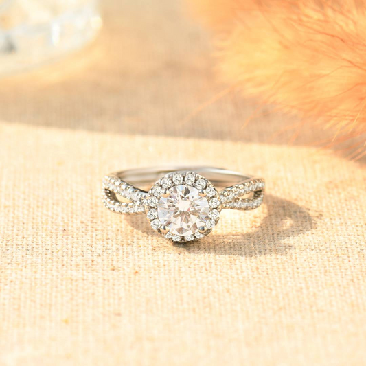 Silver ring with white stones on a plain canvas with floral background