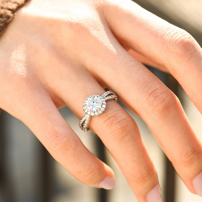 Silver ring with white stones on a woman's ring finger