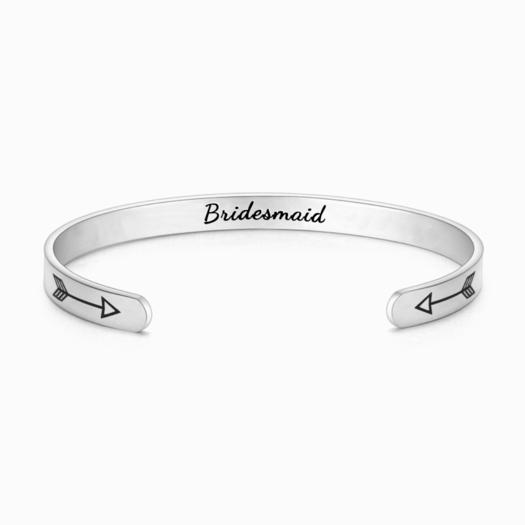 Silver bracelet with text engraving on white background