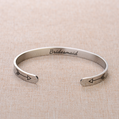 Silver bracelet with text engraving on plain canvas