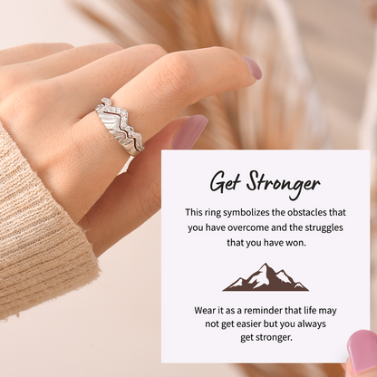 silver mountain rings with small stones stack together and an inspirational message card