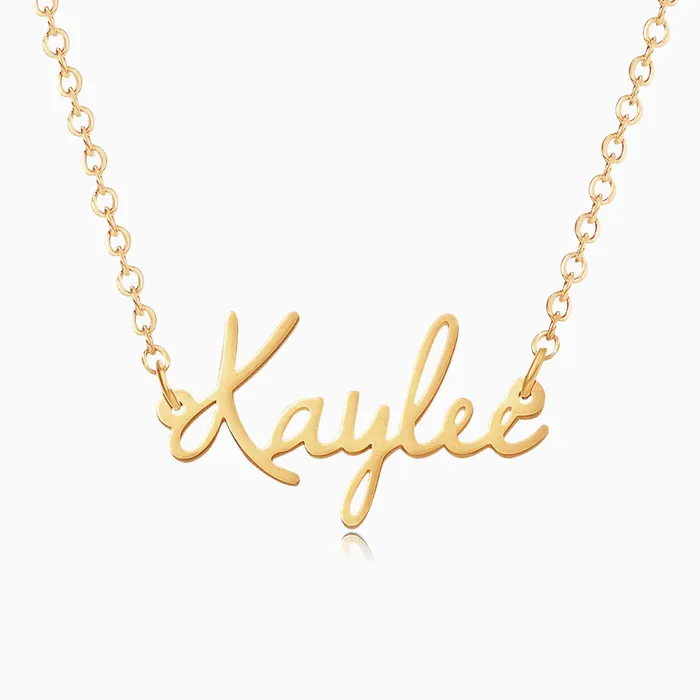 A personalized gold name necklace on a white background