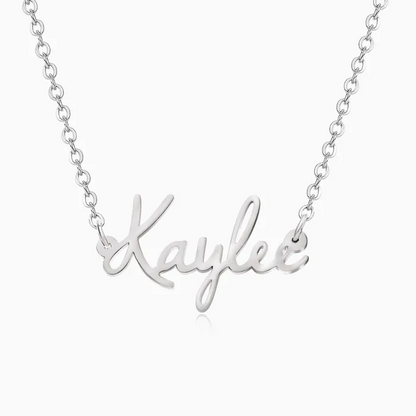 A personalized gold name necklace on a white background