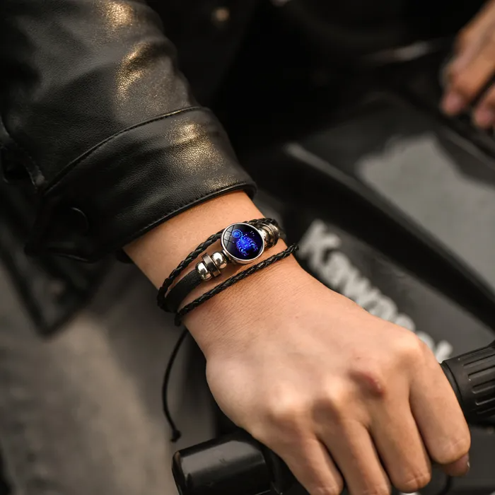 man wearing a zodiac bracelet on his wrist