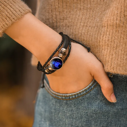 woman wearing a zodiac bracelet on her wrist