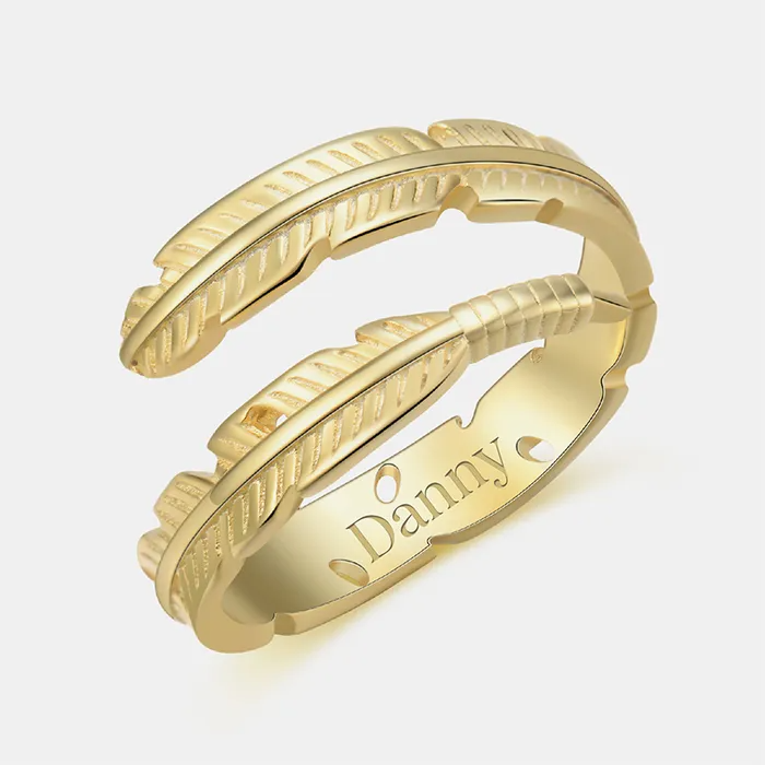 Gold feather-designed ring featuring an engraved name "Danny" on a white background.