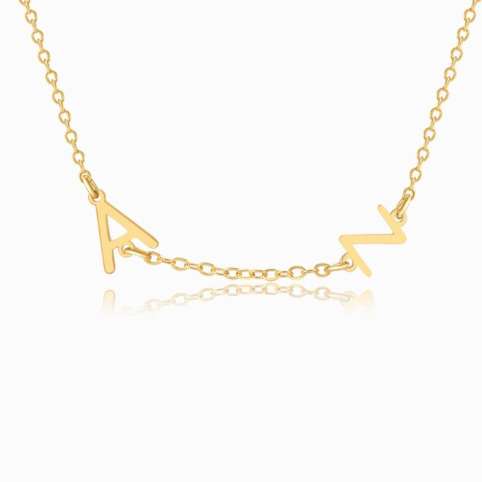 A GOLD personalized letter necklace with two letters on a white background