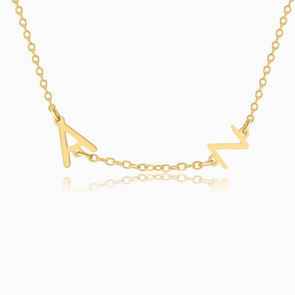 A GOLD personalized letter necklace with two letters on a white background