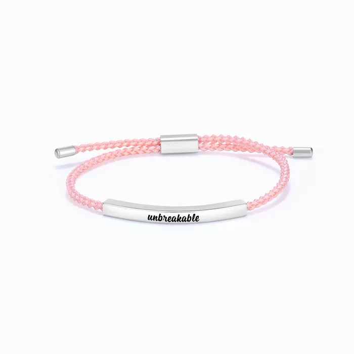 pink rope with silver bar with "unbreakable" text engraving on a white background