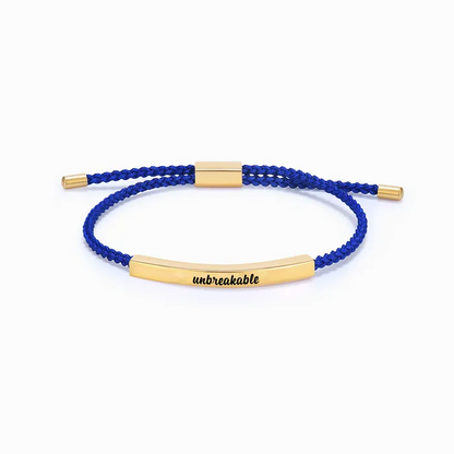 blue rope with gold bar with "unbreakable" text engraving on a white background