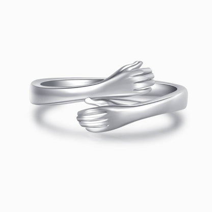 silver hug ring on a white background