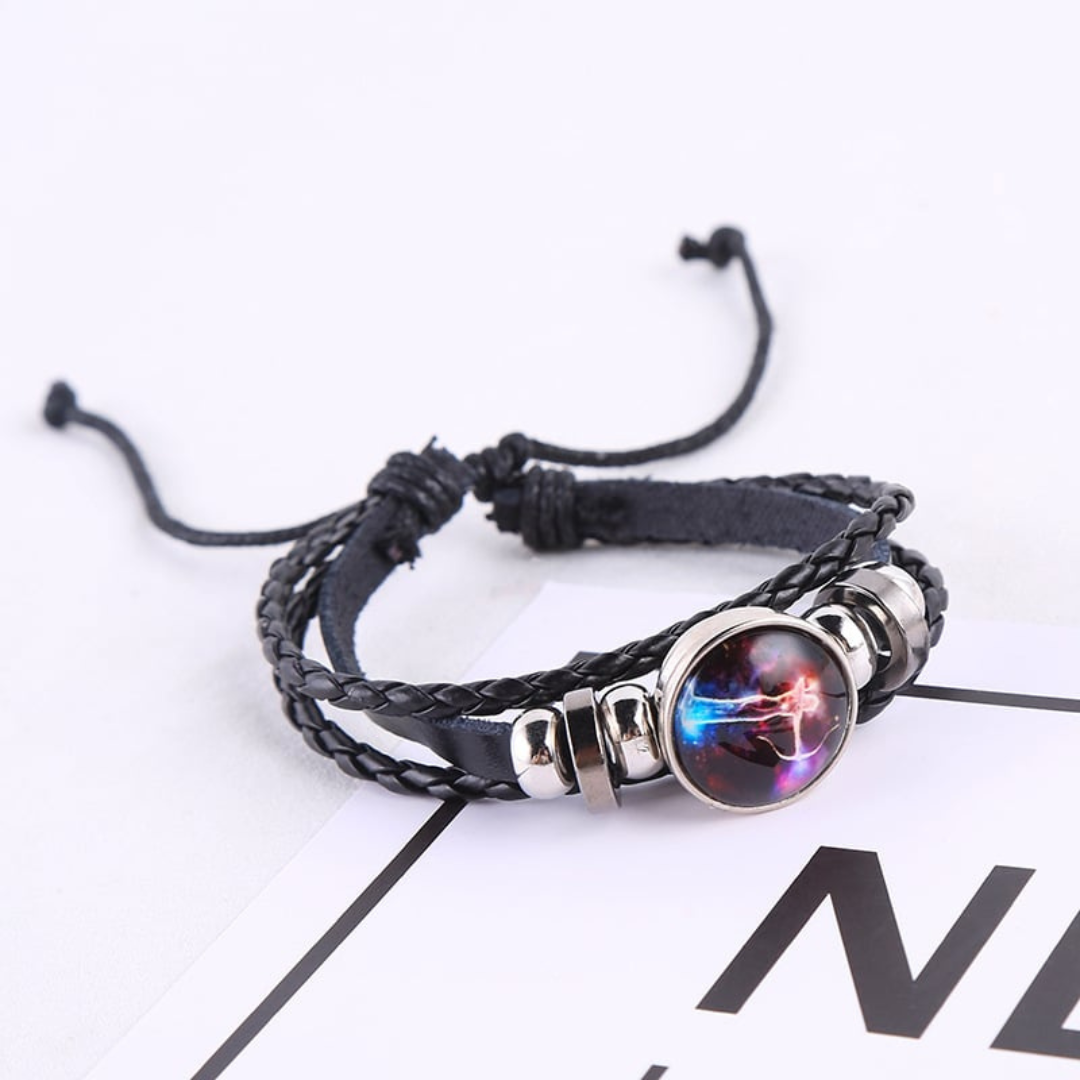 Black braided leather bracelet with a circle pendant that has a Sagittarius astrological symbol